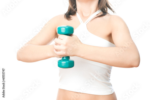 Girl with green dumbbells in hand