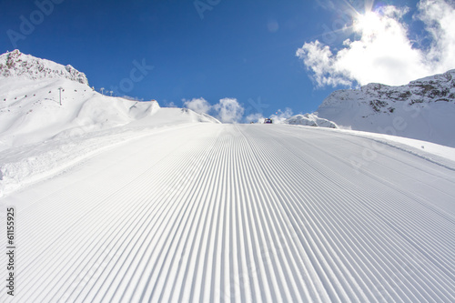 perfectly groomed empty ski piste