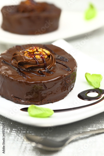 Chocolate dessert with decoration on white plate