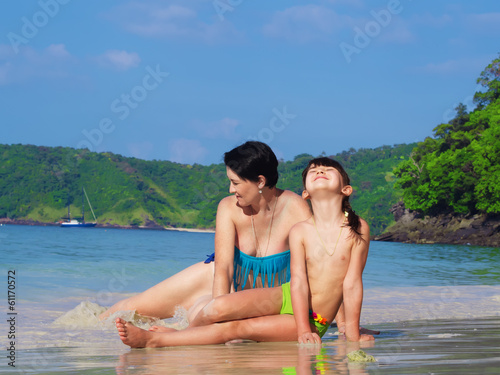 Mother and her little daughter on the beach