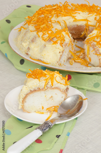 Angel food cake with cream and orange zest photo