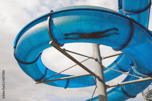 Man’s silhouette in water slide