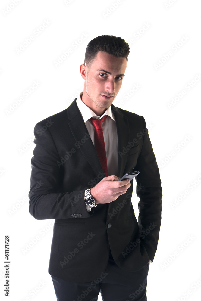 Attractive young businessman texting on cell phone Attractive young businessman texting on cell phone