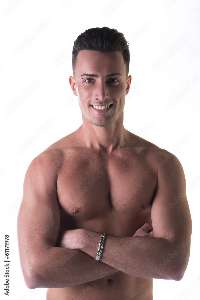 Smiling young man shirtless, arms crossed on bare chest Smiling young man shirtless, arms crossed on bare chest
