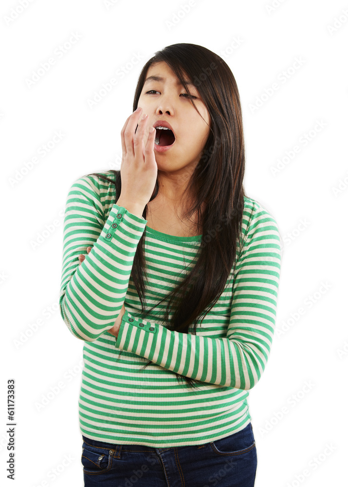 Fototapeta premium Mädchen hält gähnend ihre Hand vor dem Mund