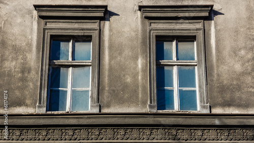 Dilapidated windows on the facade of an old tenement in Katowice