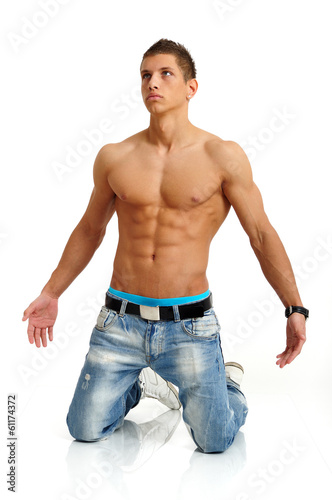 Φωτογραφία Confused handsome young man kneeling on his knees
