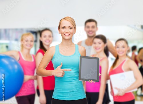 sporty woman with tablet pc blank screen