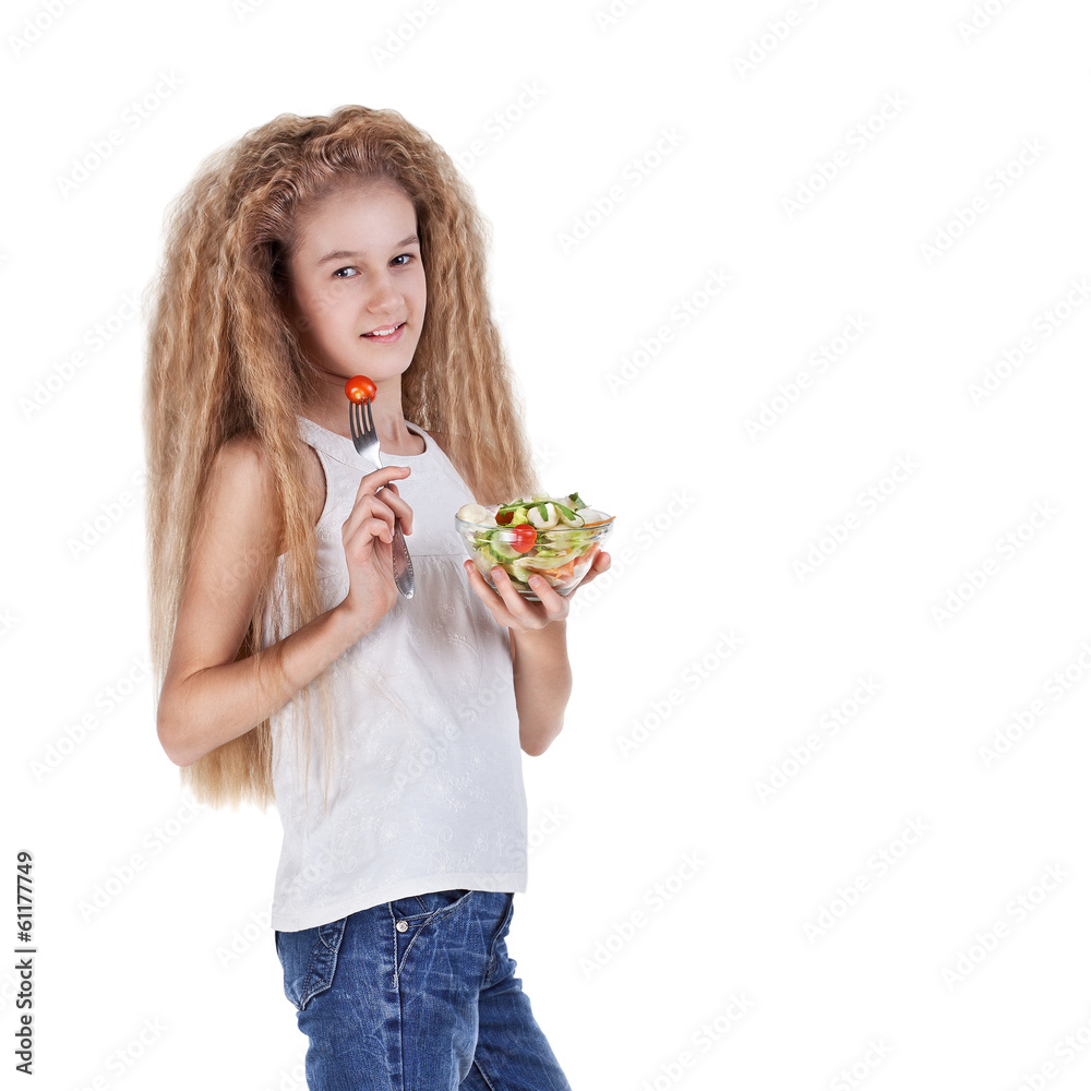 Girl with long hair eating vegetable salad