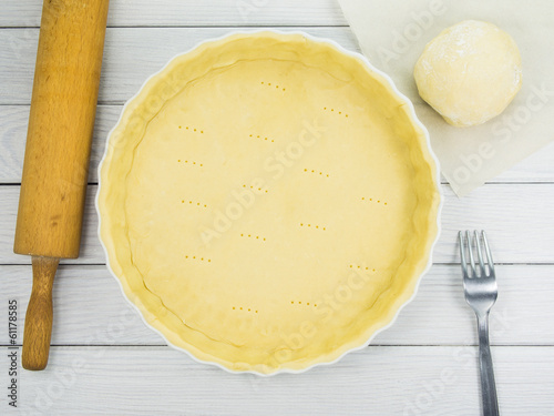 Tart / quiche dough (shortcrust pastry) in ceramic baking form