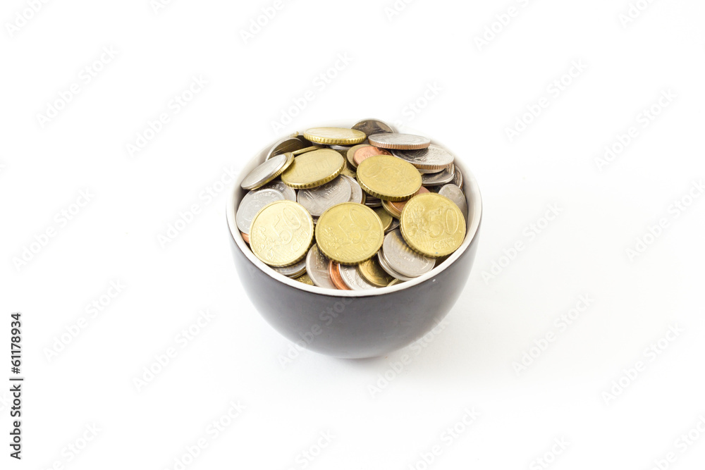 Coin in cup on white background Coin in cup on white background