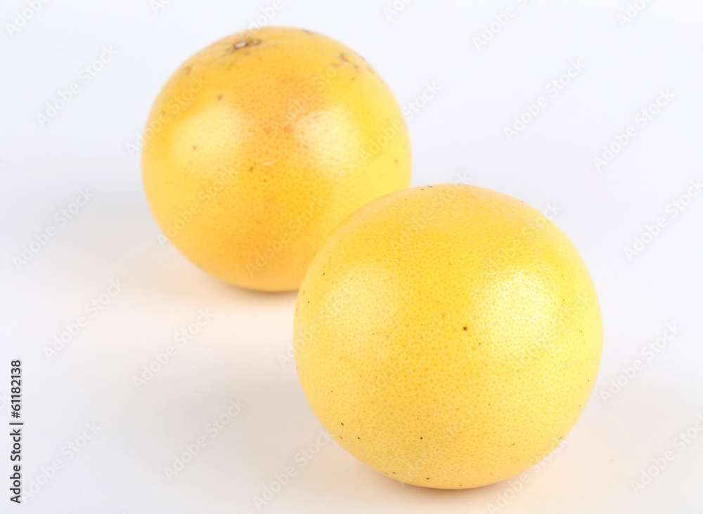 Ripe grapefruit and half isolated on white Ripe grapefruit and half isolated on white