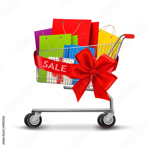 Shopping cart full of shopping bags and a gift bow. Concept of d