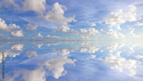 Reflection of beautiful blue sky with clouds