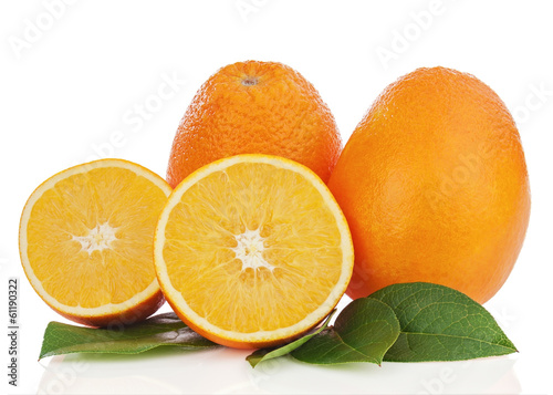 Orange fruits with green leaves isolated on white background.