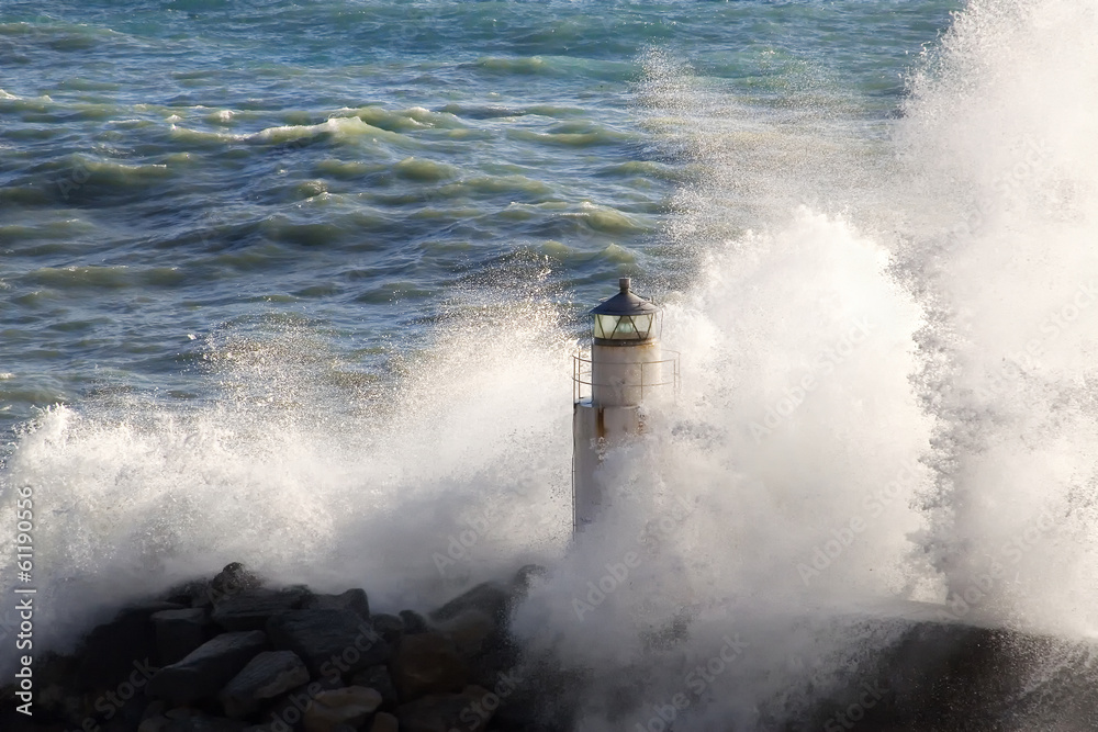 lighthouse with rough sea in Camogli