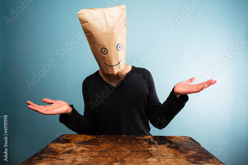 Confused man with bag over head