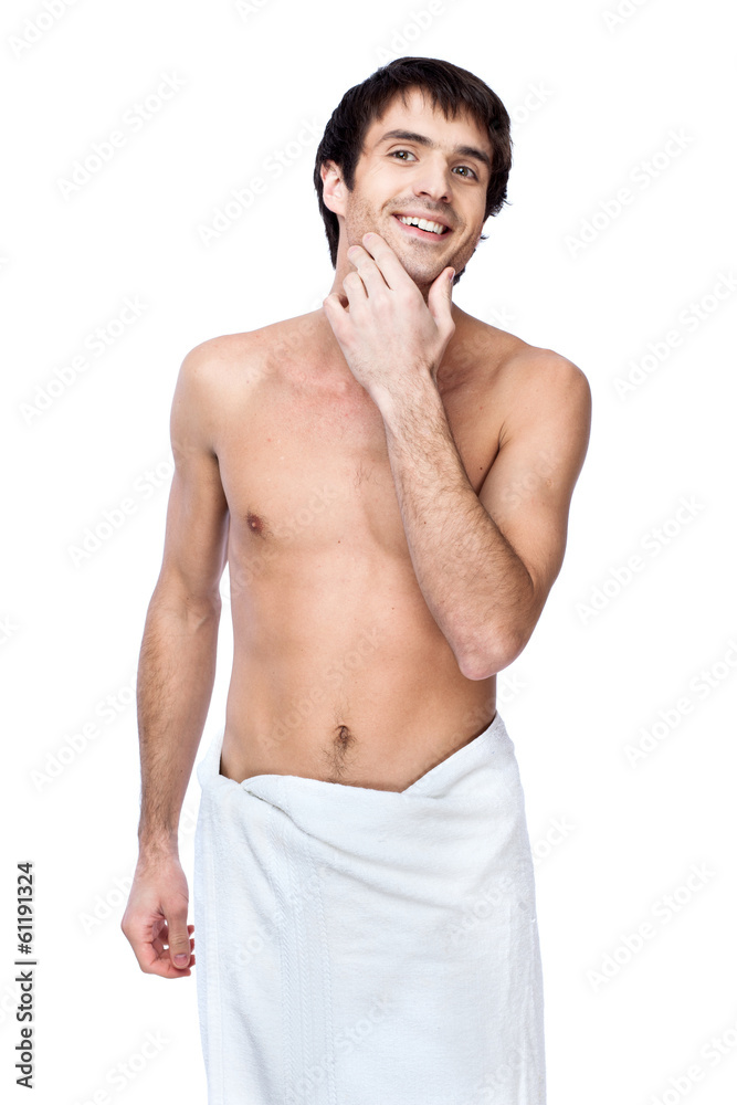happy young man with the towel around his waist happy young man with the towel around his waist