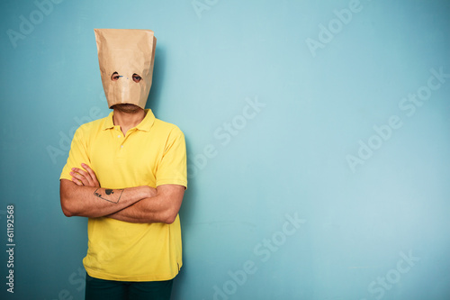 Young man with bag over his head