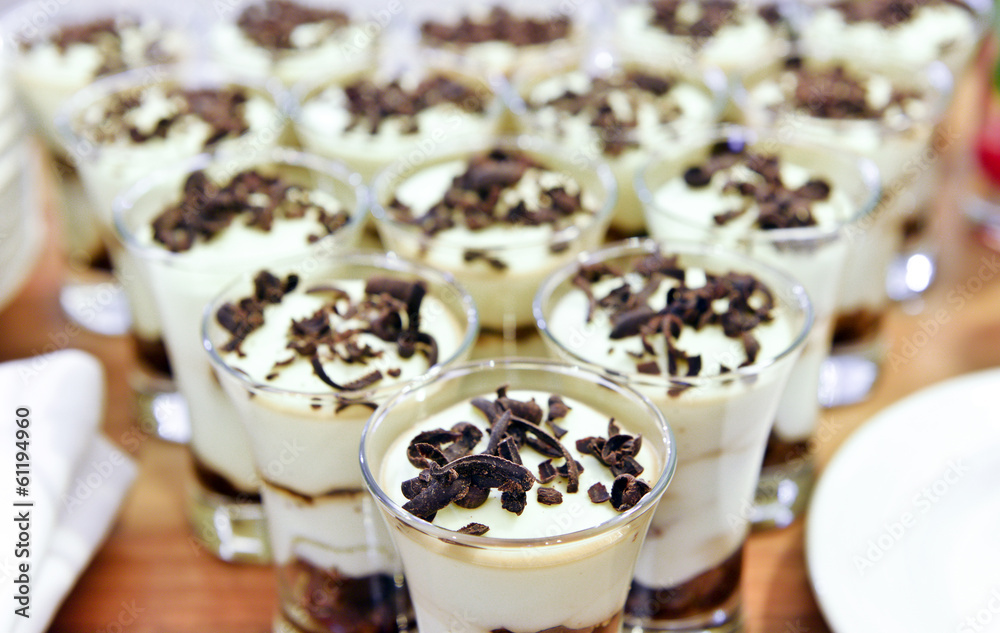Tiramisu, Panna cotta on the buffet table Tiramisu, Panna cotta on the buffet table