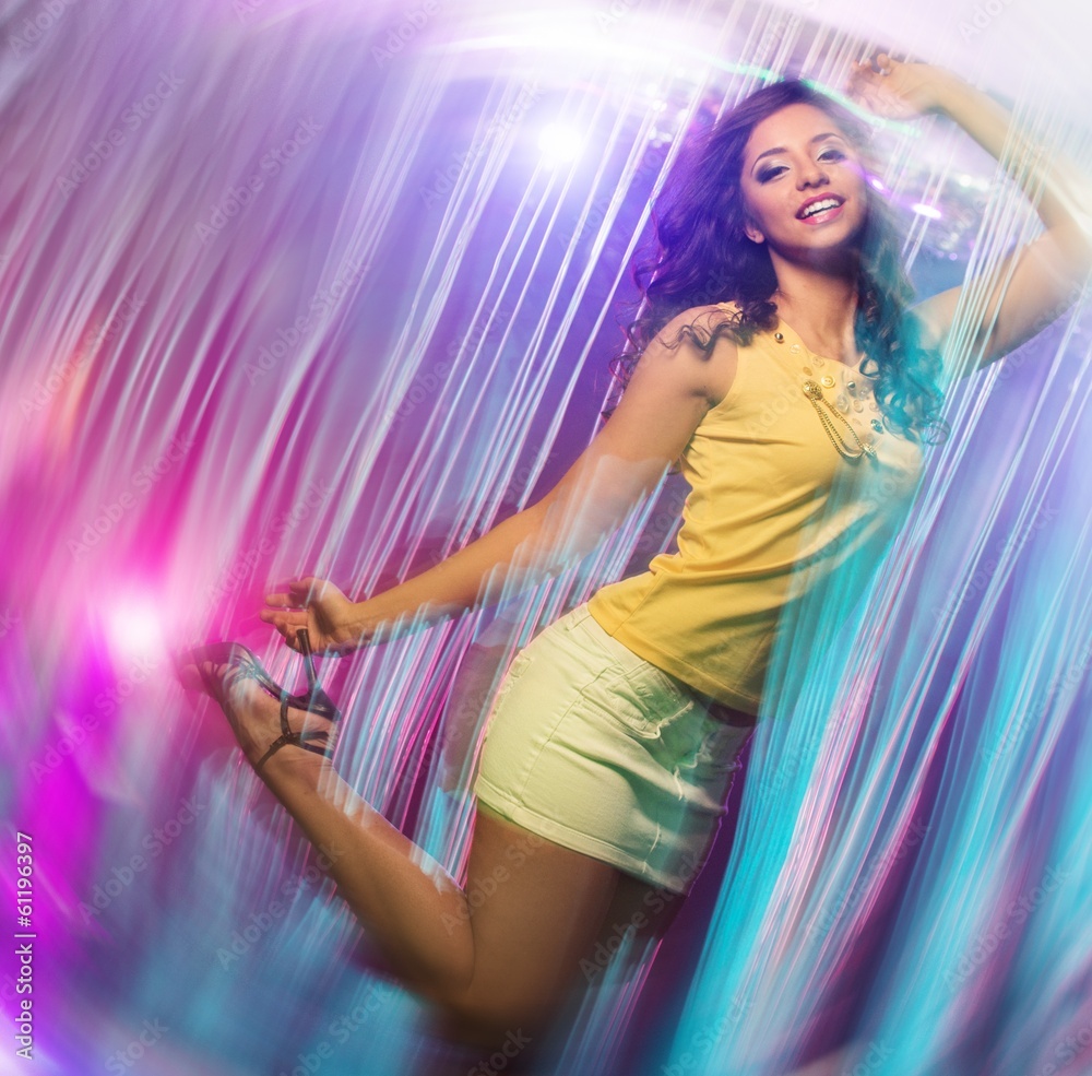 Beautiful young brunette woman dancing at the night club Beautiful young brunette woman dancing at the night club