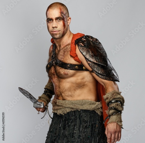 Wounded gladiator with cold weapon