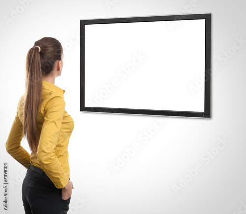 Business woman looking at tv