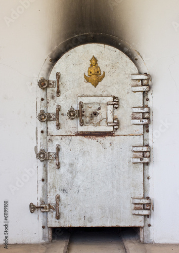 Ancient crematory door in temple of Thailand © kurapy