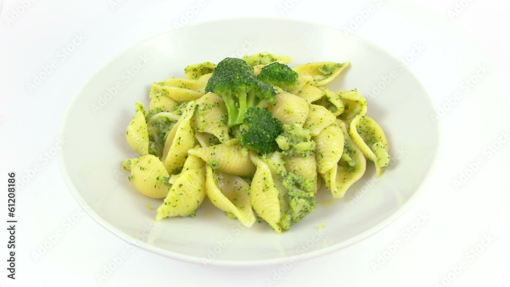 pasta with broccoli rotating on a white background pasta with broccoli rotating on a white background