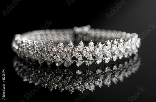 Fototapet Jewelry diamond bracelet on a black background