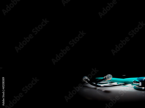 Stethoscope in a spotlight on black background