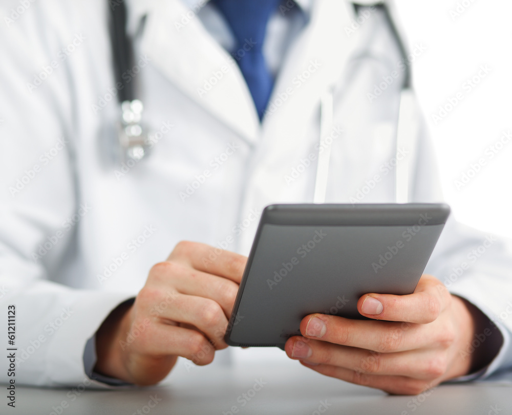 Unknown doctor using computer plane-table.
