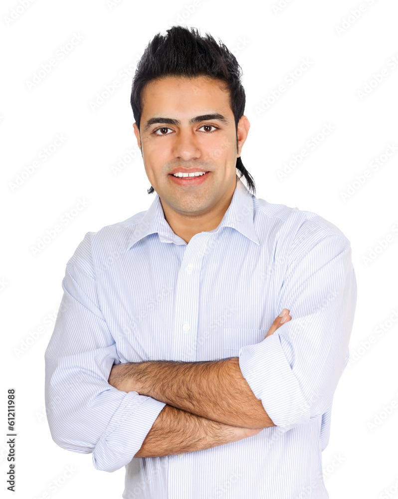 Handsome young business man standing with folded arms