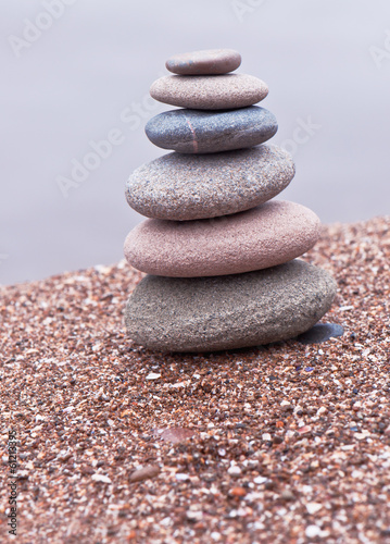 tower of stones on sand