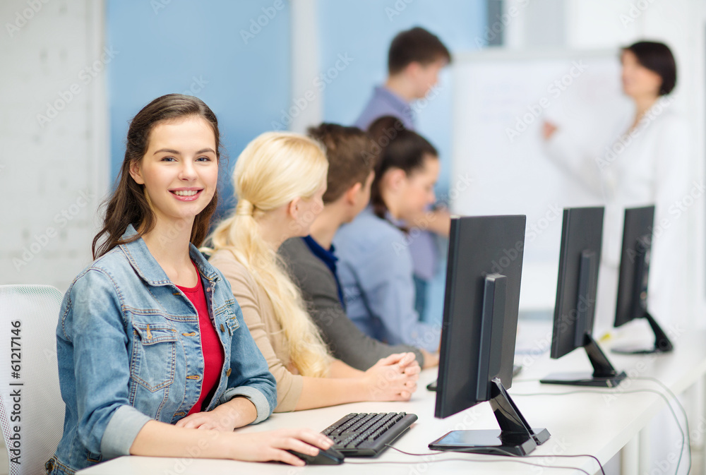 smiling teenage girl with classmates and teacher