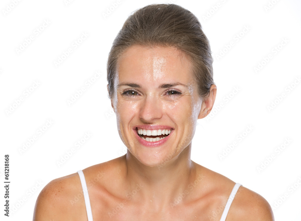 Portrait of smiling young woman with wet face Portrait of smiling young woman with wet face
