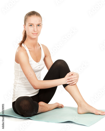 Wallpaper Mural A sportive young girl sitting on the floor Torontodigital.ca