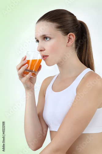 woman drinking orange juice vitamin