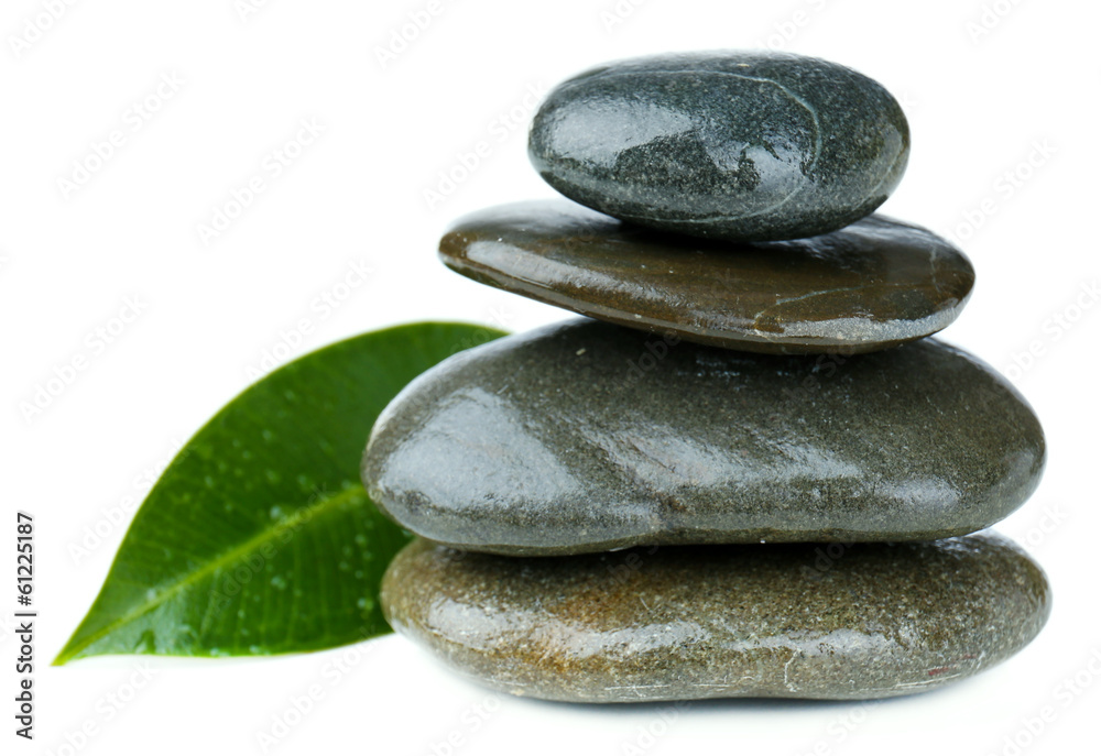 Spa stones with green leaf, isolated on white Spa stones with green leaf, isolated on white