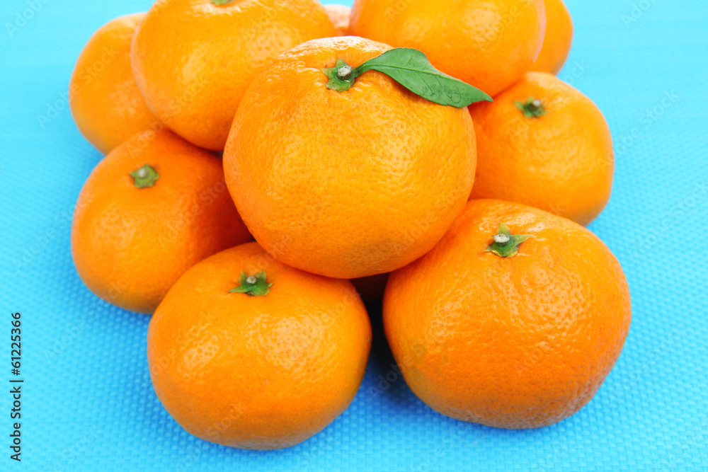 Ripe sweet tangerines, on color background Ripe sweet tangerines, on color background
