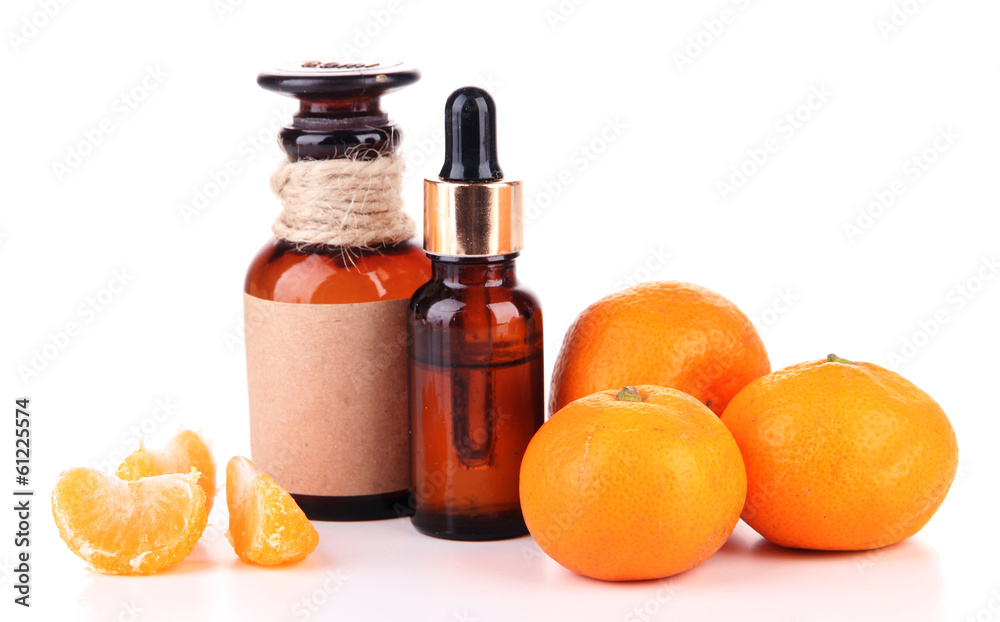 Tangerine essential oil and tangerines, isolated on white Tangerine essential oil and tangerines, isolated on white