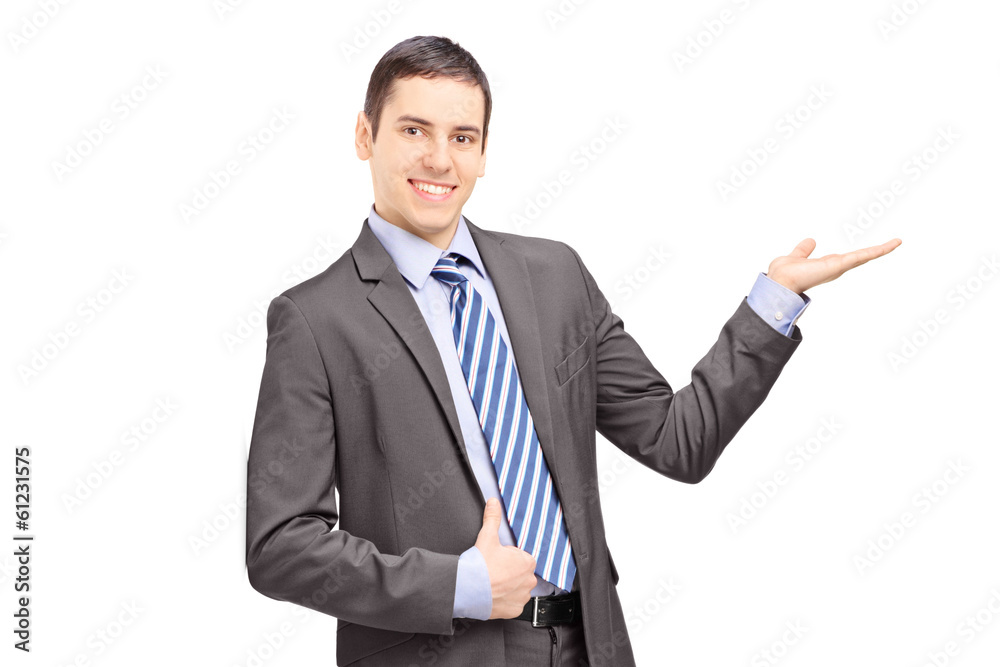 Young businessman leaning against wall and gesturing Young businessman leaning against wall and gesturing