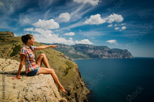 Young woman  on a rock