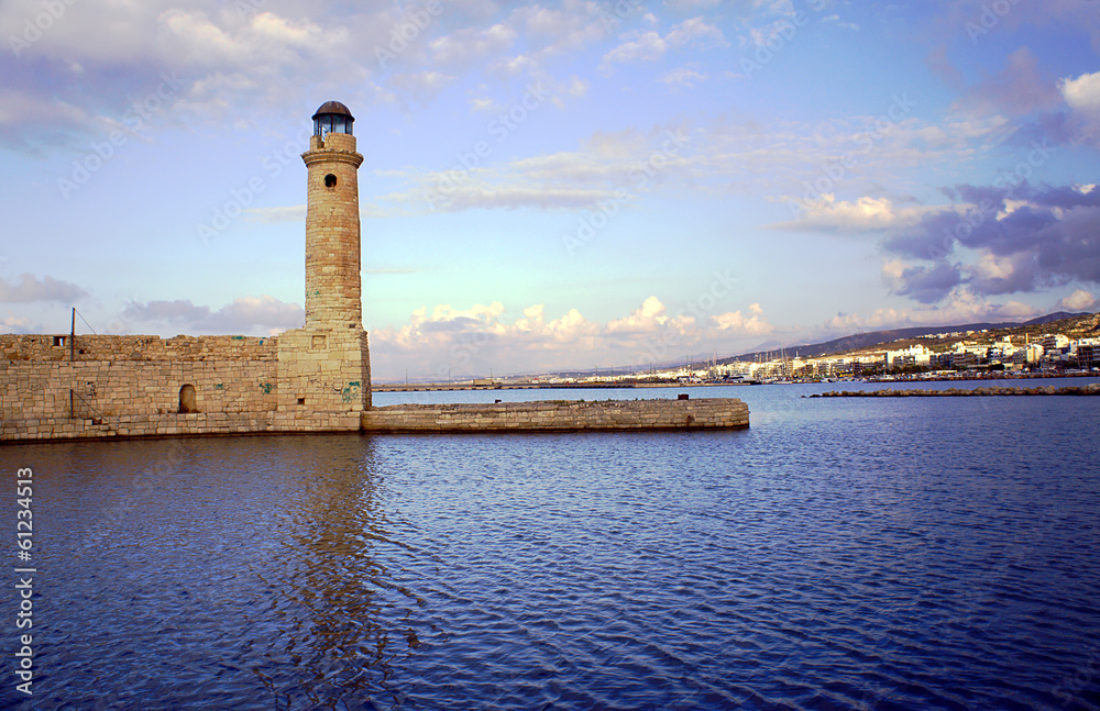 Venetian lighthouse in the old harbor, Rethymno, Crete.