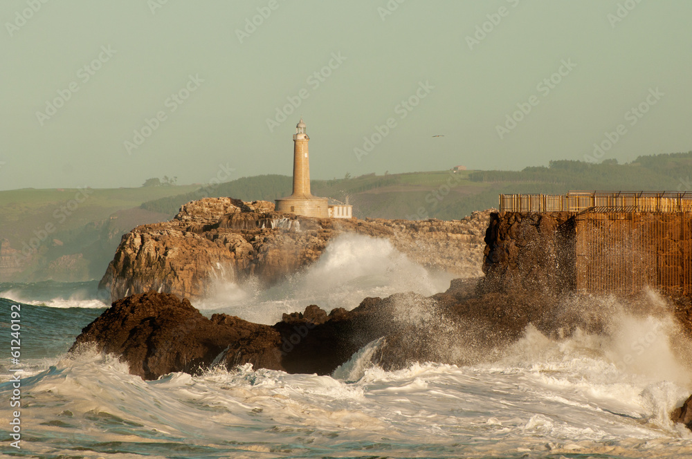 Lighthouse in the big waves, storm in Mouro, Santander, Spain