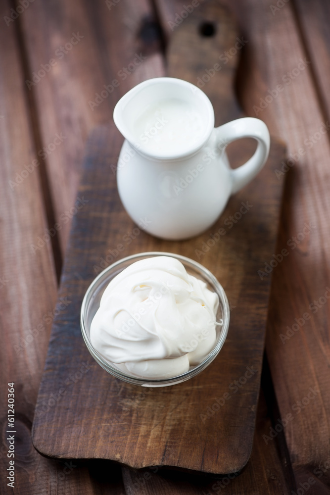 Freshly made sour cream, rustic wooden background Freshly made sour cream, rustic wooden background