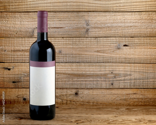 Wine bottle on wooden background