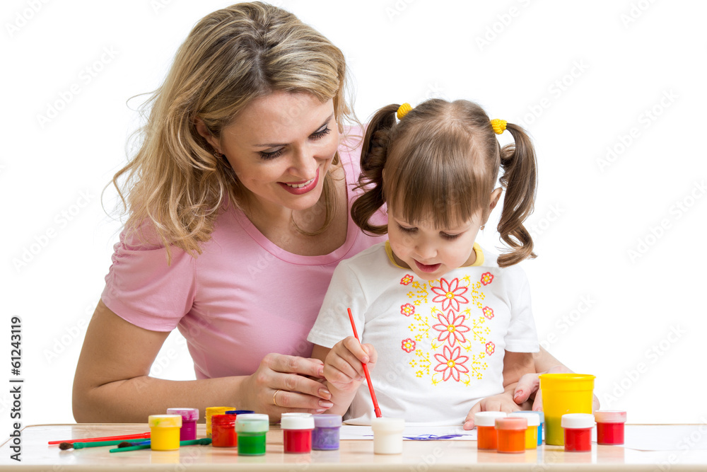 Mother and kid girl painting together Mother and kid girl painting together