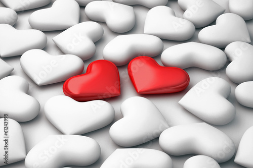 two 3d red hearts on white hearts background photo