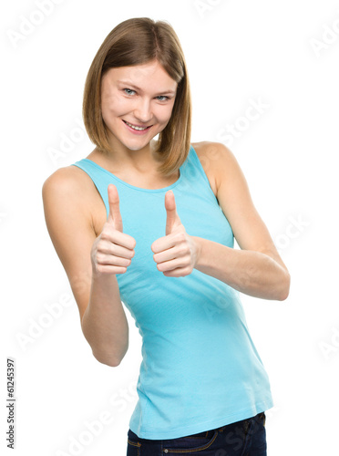 Woman is showing thumb up gesture